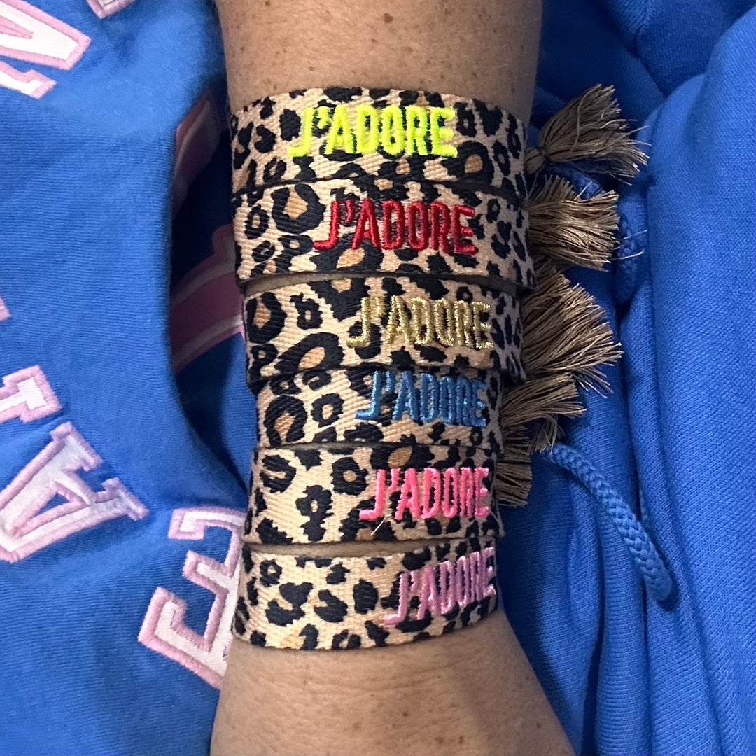Six leopard woven cotton bracelets stacked on the wrist, French embroidery in neon yellow, red, gold, denim blue, neon pink and Miami pink – La Maison Angélique Dubai