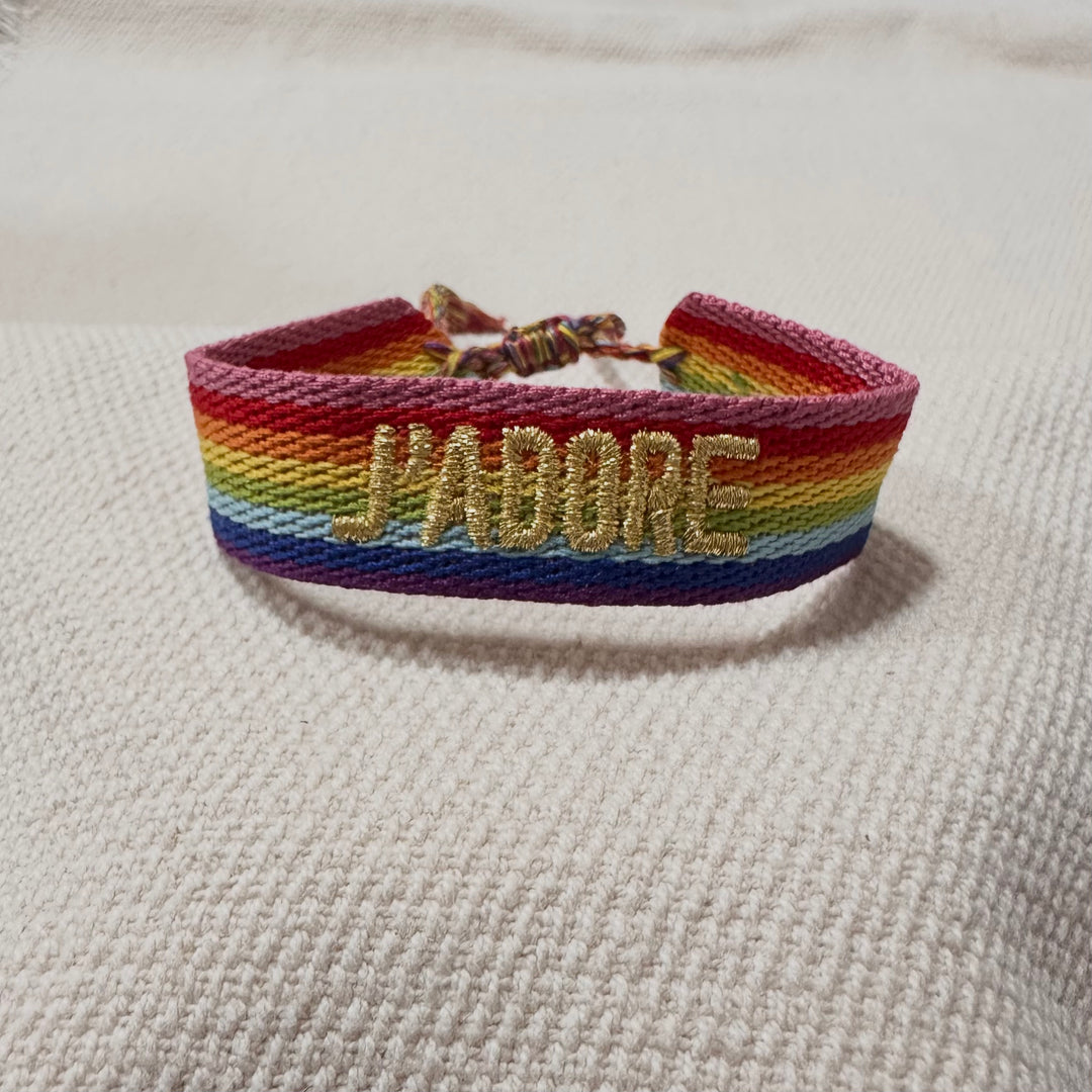 Rainbow woven cotton bracelet with gold embroidered lettering