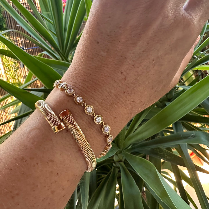 Waterproof gold tennis bracelet stacked with MILA open cuff
